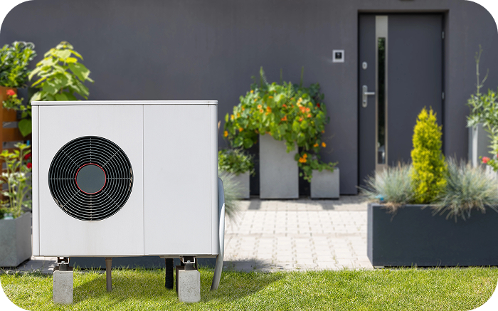a white box with a fan in the middle of grass